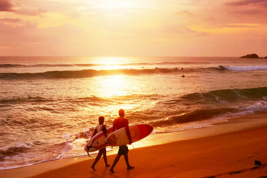 Tourists watching the sunset from Coconut Tree Hill in Mirissa, Sri Lanka